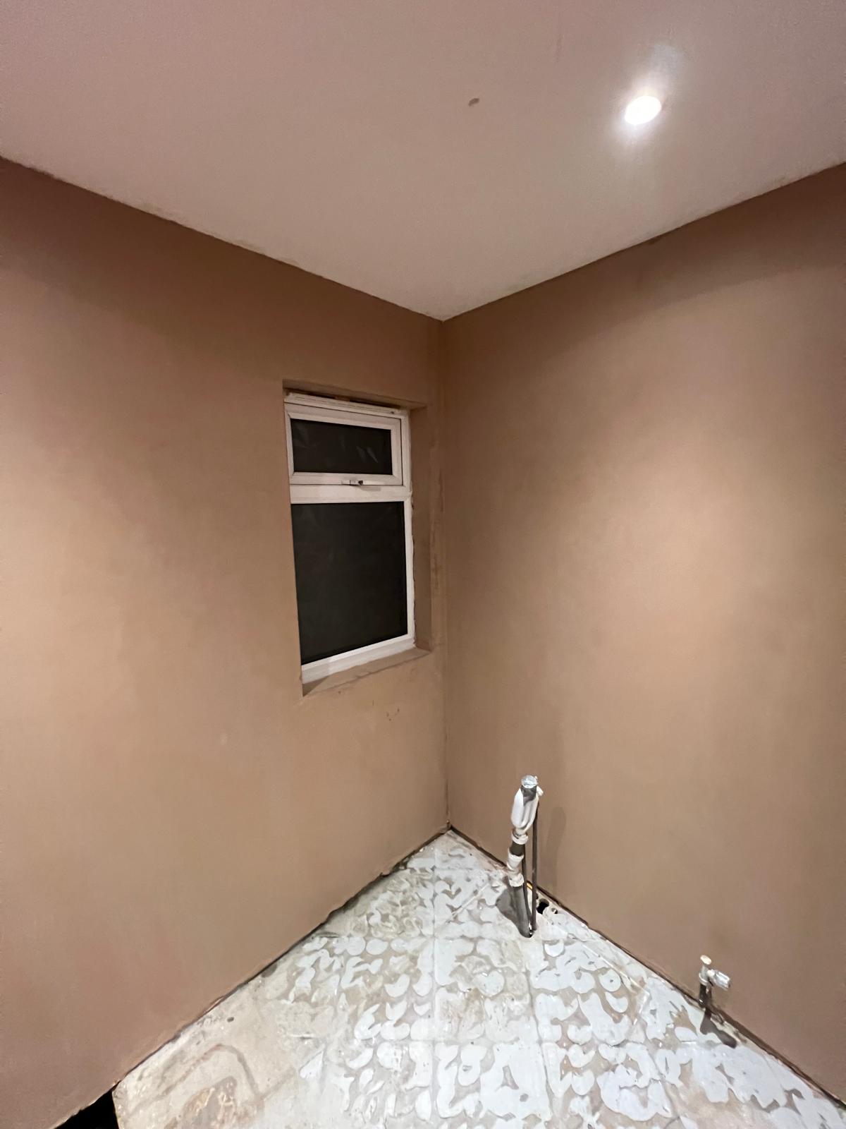 Freshly plastered bathroom walls